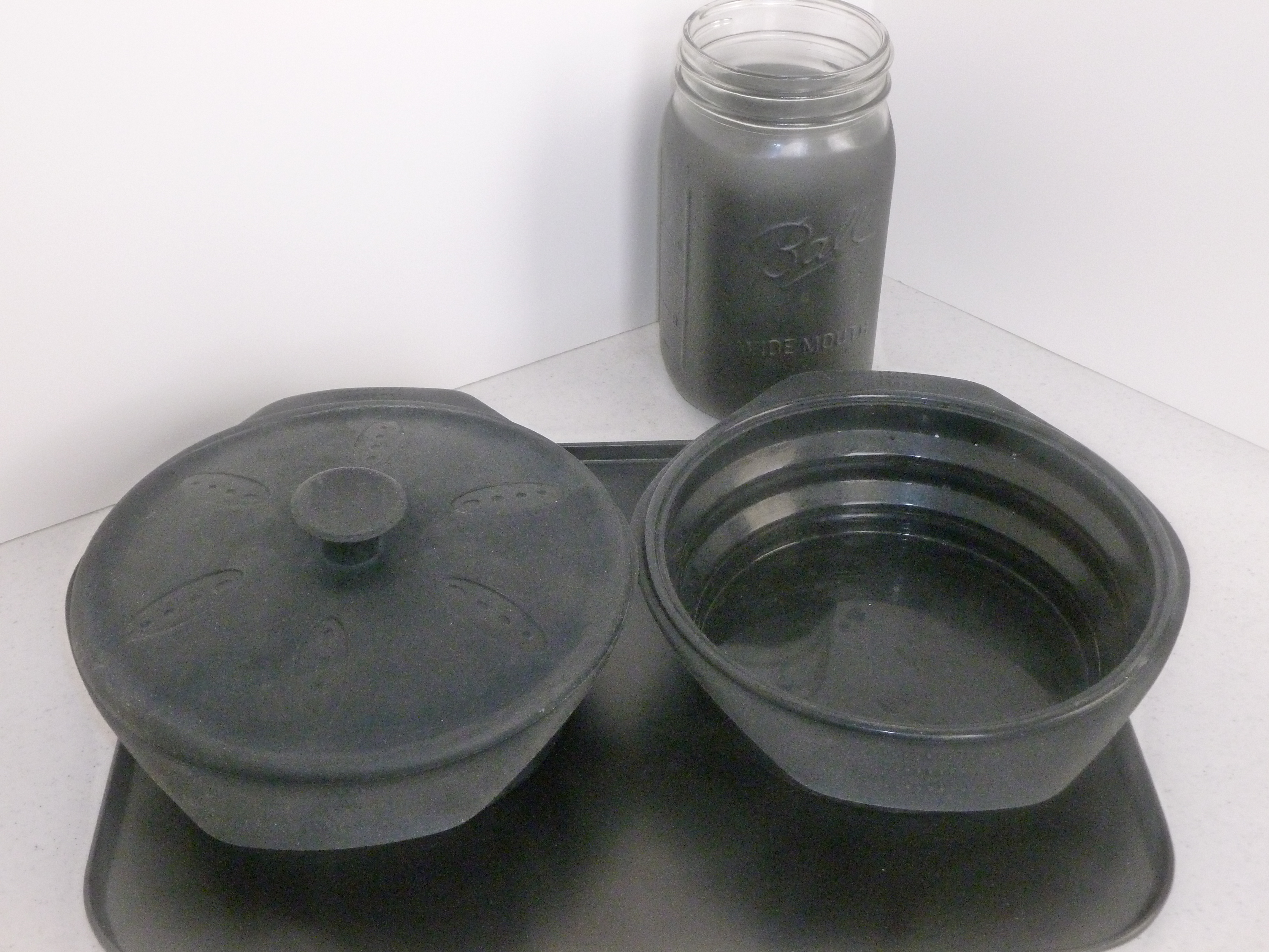 Black Silicon pots, black cookie sheet, black painted canning jar Cookware Guide for solar oven cooking